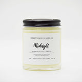 straight sided glass jar candle with black twist off metal lid and white label